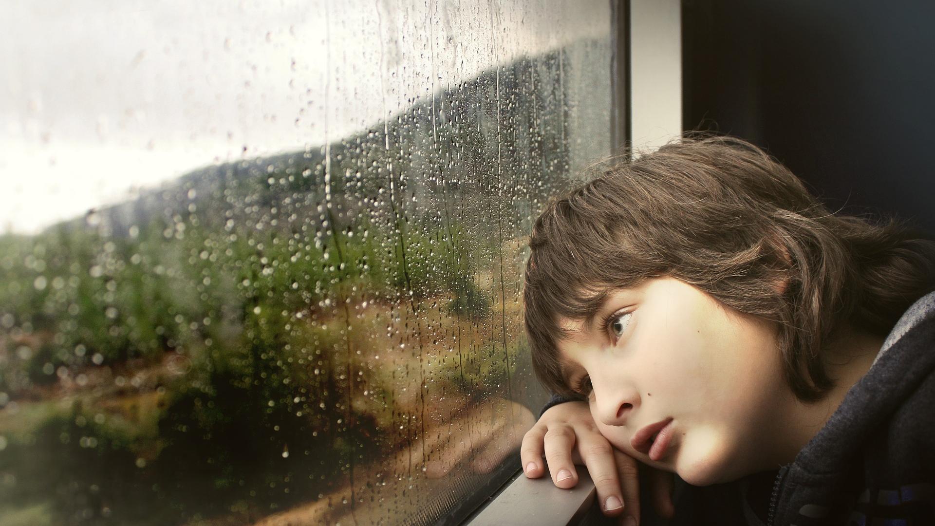child looking out of train window