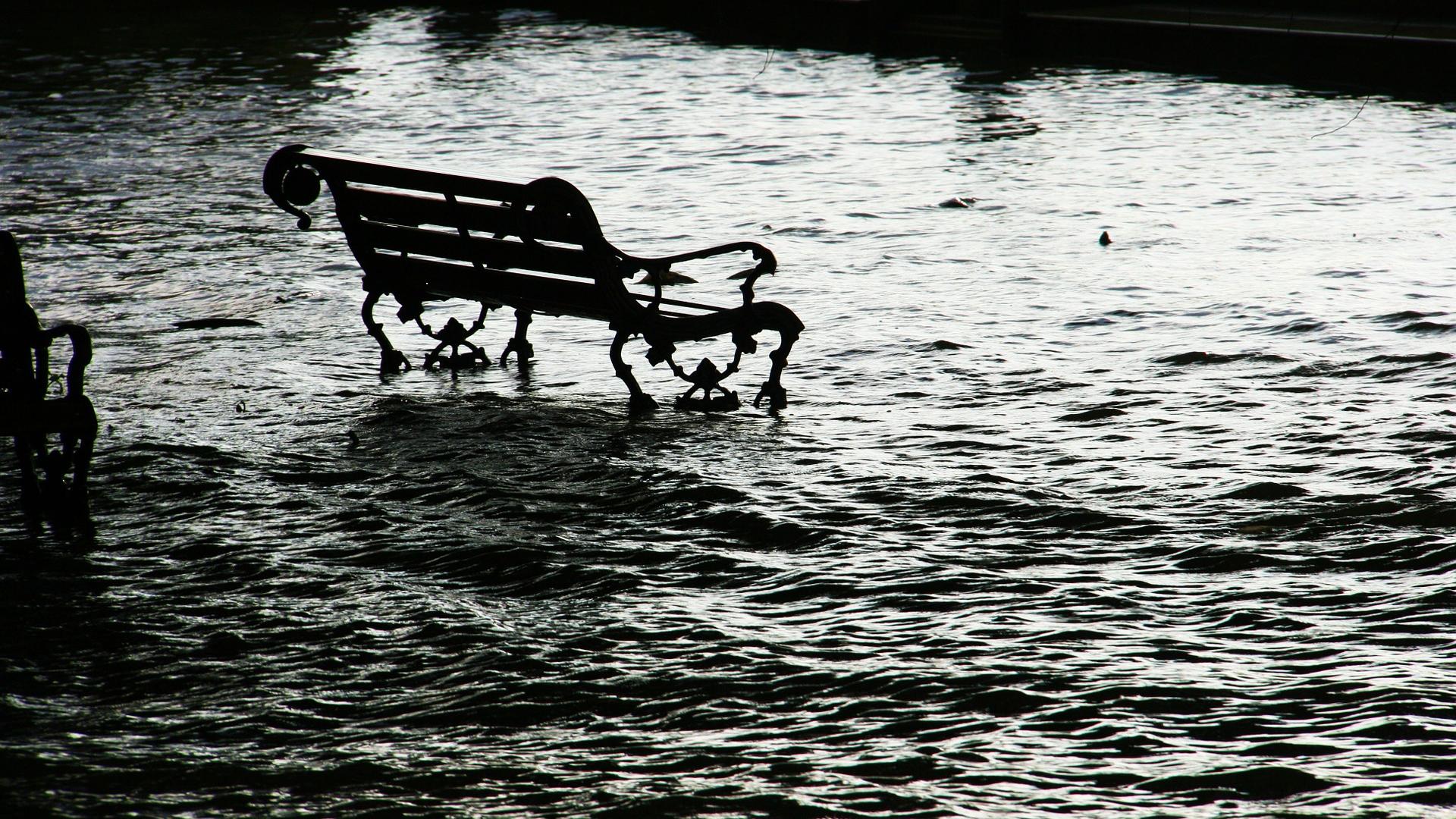 Park bench marooned in flood water