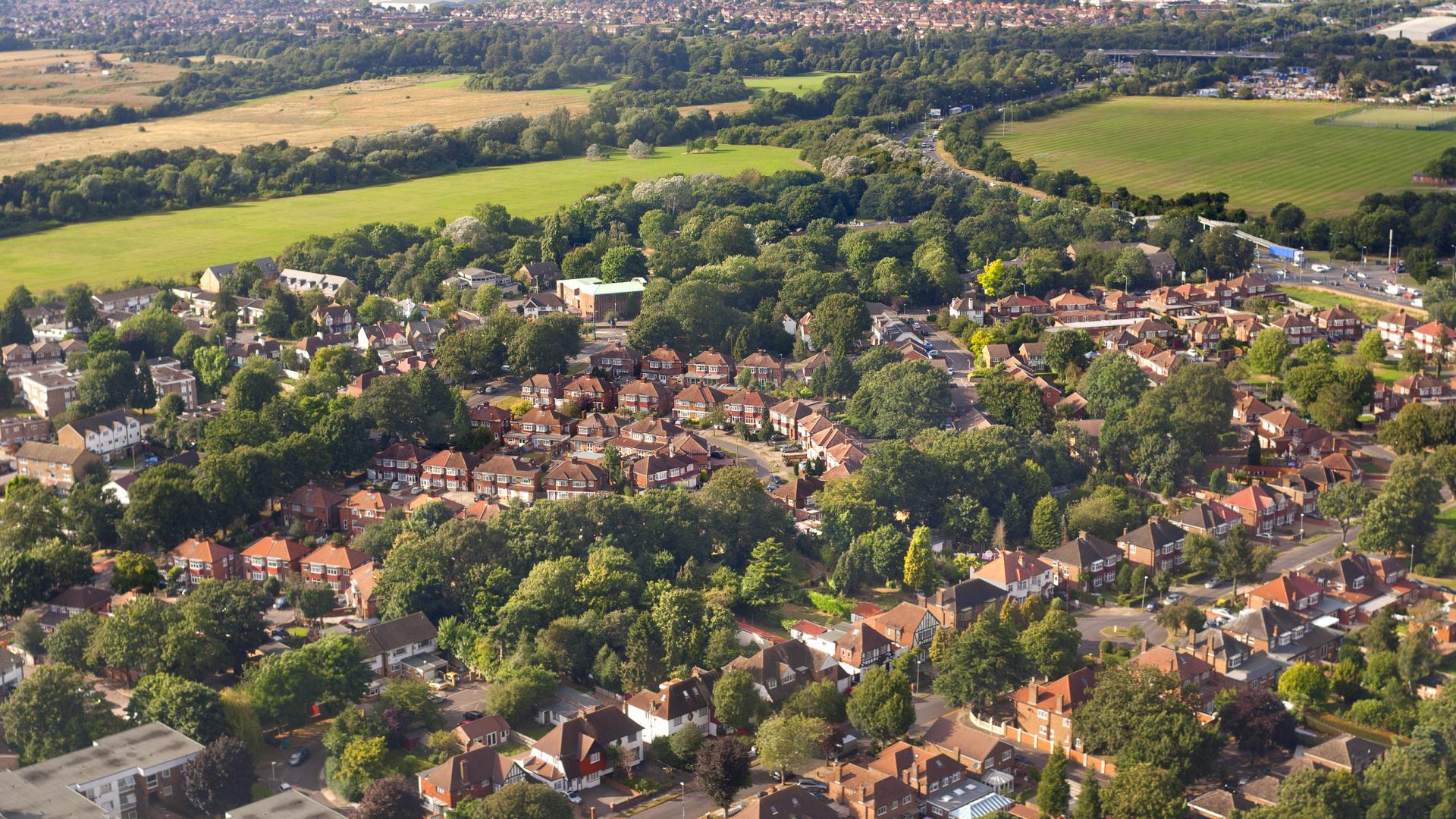 An aerial view of houses and trees