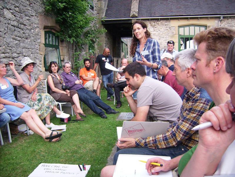 Group of people in discussion outdoors