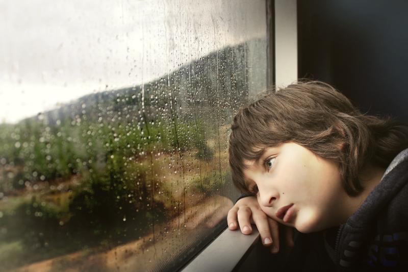 child looking out of train window