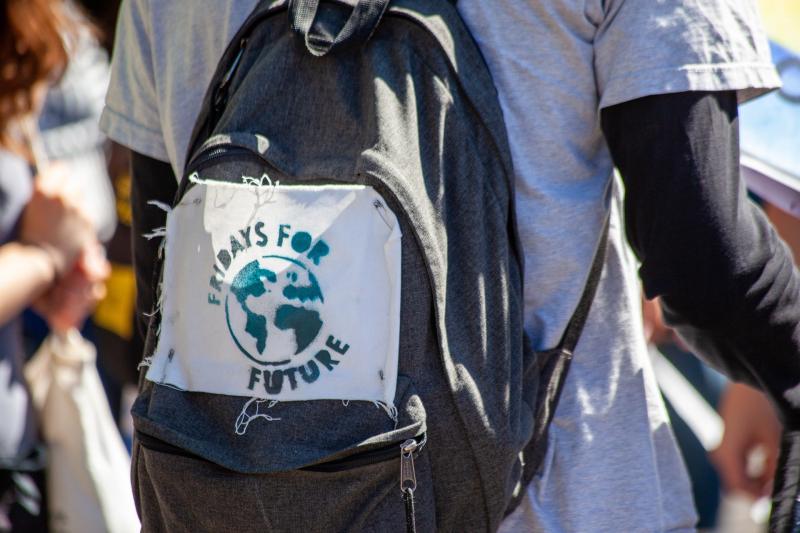 View of school striker's rucksack with Fridays for Future label