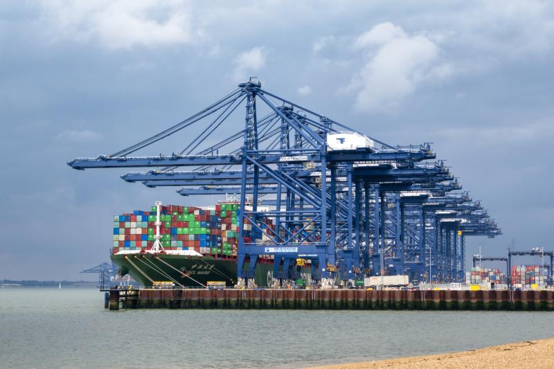Container ship being unloaded at Felixstowe by giant cranes
