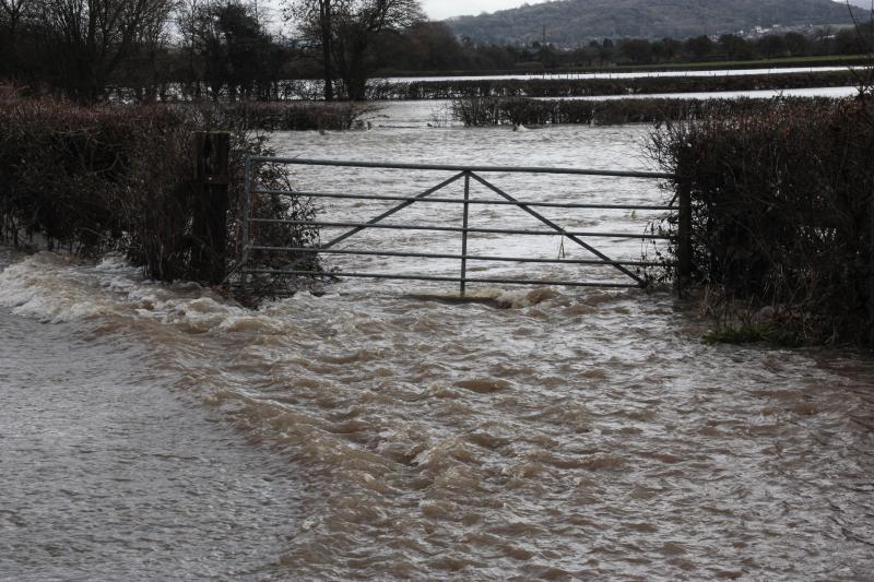 river Severn having burst its banks floods fields, gateway and road