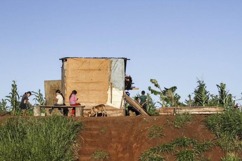 Temporary roadside shacks lived in by people who have been displaced as their land has been taken over for soy fields, Alto Parana, Paraguay
