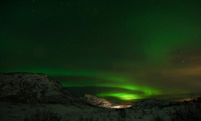 Aurora Borealis – the northern lights over snowcapped peaks