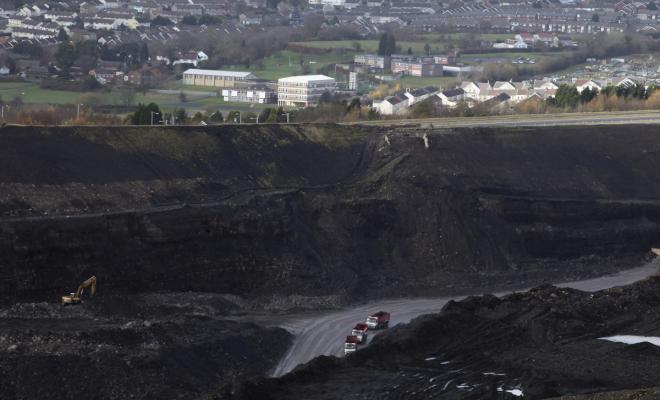 Quarry lorries move materials around the Ffos-Y-Fran opencast coal mine on November 17, 2009 in Merthyr Tydfil, Wales. 