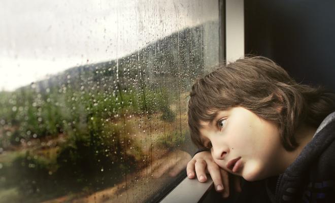 child looking out of train window
