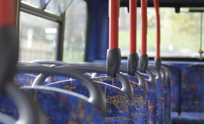 A line of empty seats on a bus